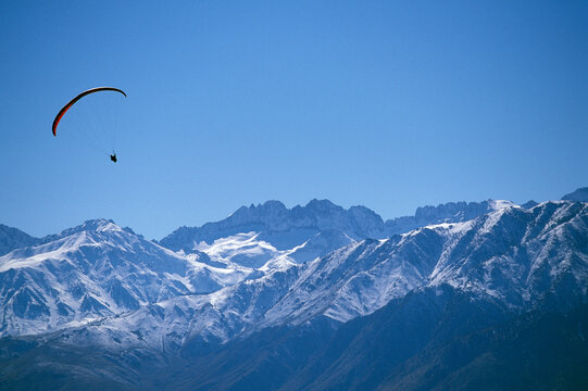 Paraglider flying in Owens Valley, California.