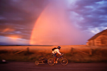Mountain biking past a rainbow near Driggs, Idaho.