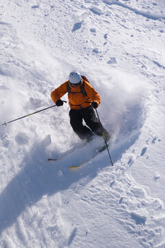 A man skiing powder snow at Kirkwood ski resort in California
