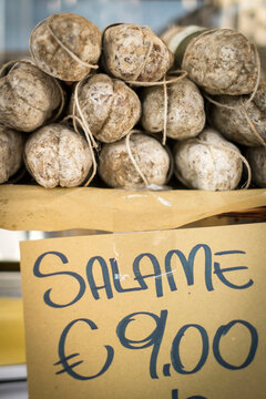 Salame is stacked and sold at a market in Buonconvento, Italy.