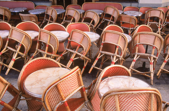 Chairs at a cafe' in Paris, France.