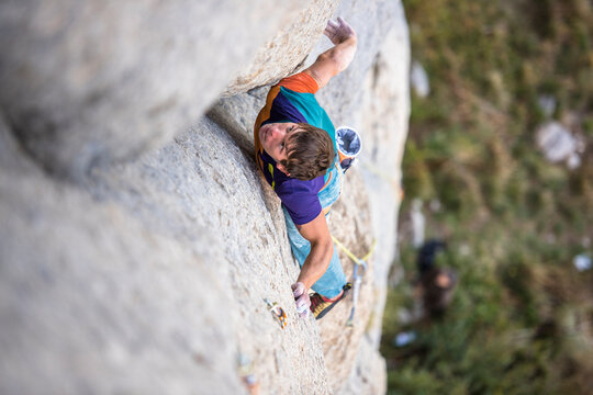 Men climbing a sport route on limestone in Ceuse, France.