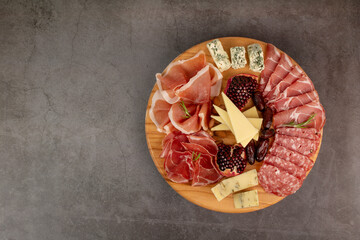 Appetizers table with different antipasti, charcuterie, snacks and cheese. Buffet party. Top view,...