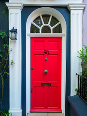Fototapeta na wymiar Brightly coloured traditional English house door in London