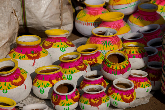 Hand-painted clay pots for sale.