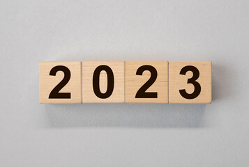 2023 new year on cubes on gray background