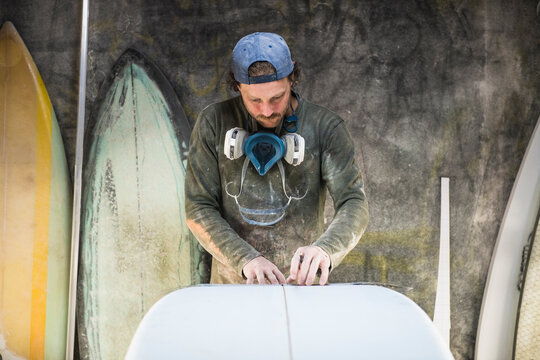Surfboard Shaper measuring a new design