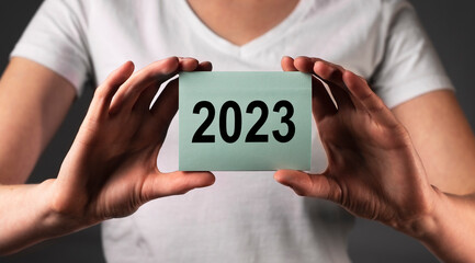 2023 new year on paper in human hand