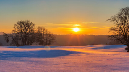 Scenic view of sunset and snow field