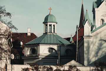 The tower of an old church with a cross on top in the old town