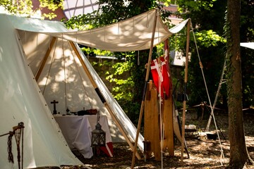 Medieval encampment with a tent and the Denmark flag hanging outside - obrazy, fototapety, plakaty