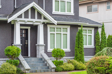 Fragment of a house with nice outdoor landscape at dusk