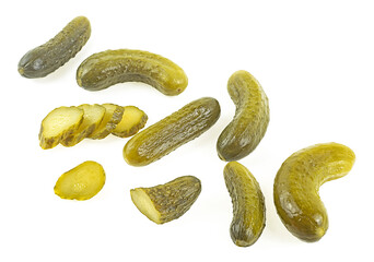 Collection of pickled cucumbers and slices isolated on a white background. Pickled gherkins. Cornichons.