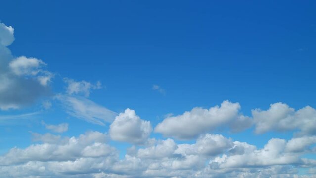 Beautiful white cumulus and cirrus on different layers clouds. Slowly move of white cloudscape. Timelapse.