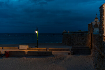 The beginning of Paseo Fernando Quinones at La Caleta during sunset, Andalusia, Spain