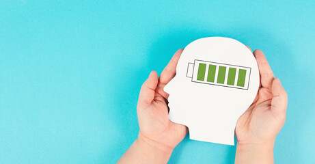 Head with a full loaded battery, positive thinking and mental health concept, brain with energy power