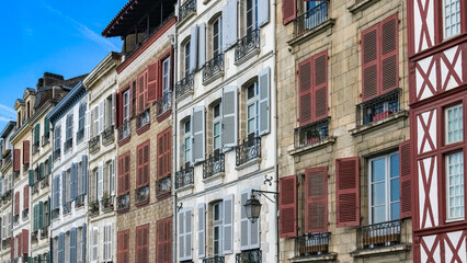 Bayonne in the pays Basque, typical facades with colorful shutters in the historic center
