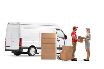 Full length profile shot of a courier with a van handing a cardboard box to a young female