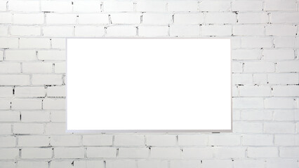 White screen LED TV on a brick white wall indoors. Living room. The concept of a country house.