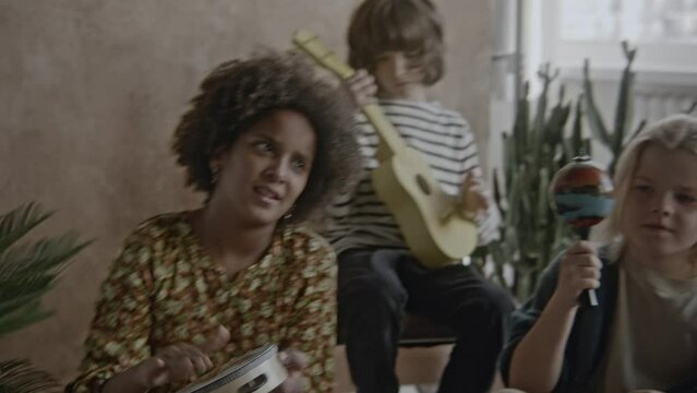 a group of children playing music together in a band