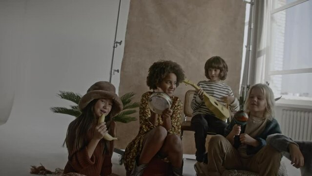 a group of children playing music together in a band