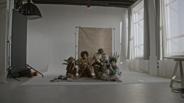 a group of children playing music together in a band
