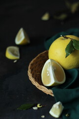 Grapefruit in a basket, a minimalist still life composition in a dark style.