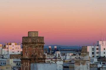 Colorful sunset over the historic center of the ancient city of Cádiz in Andalusia Spain