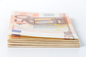 stack of paper money with 50 euro banknote, selective focus