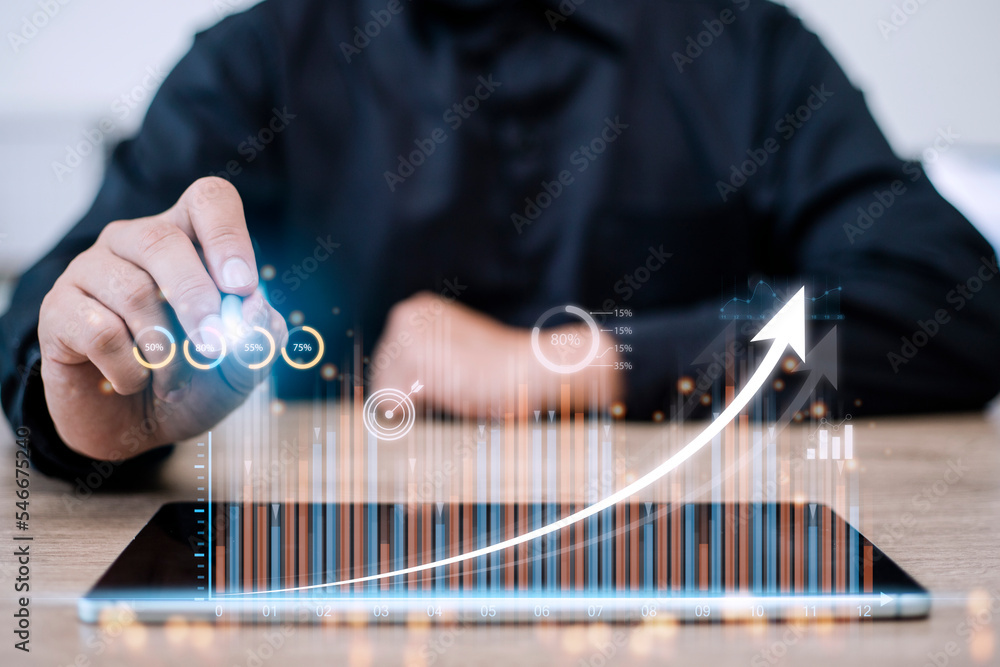Poster people using tablets and using his finger to touch the screen with a business graph showing up in a 