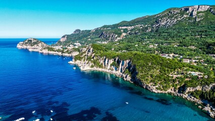 Aerial of the Corfu island surrounded by turquoise waters of Ionian sea, Cape Drastis in Greece