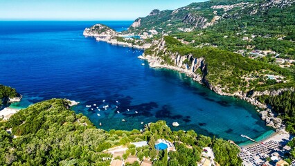 Aerial of the Corfu island surrounded by turquoise waters of Ionian sea, Cape Drastis in Greece