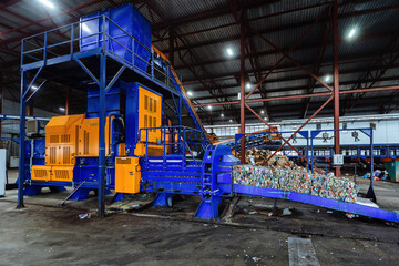 Fototapeta na wymiar Modern waste processing plant. Sorting, pressing and packing of garbage