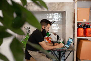 Shop local business owner at work with laptop