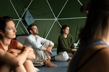 Group focused on learning healthy practice in yoga studio