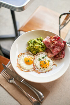 Thick Cut Bacon With Fried Eggs And Avocado