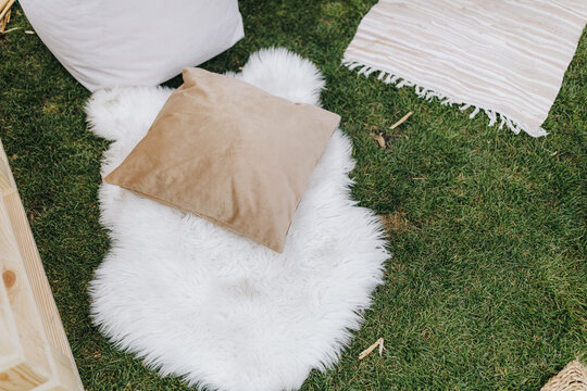 Blankets and cushions on grass