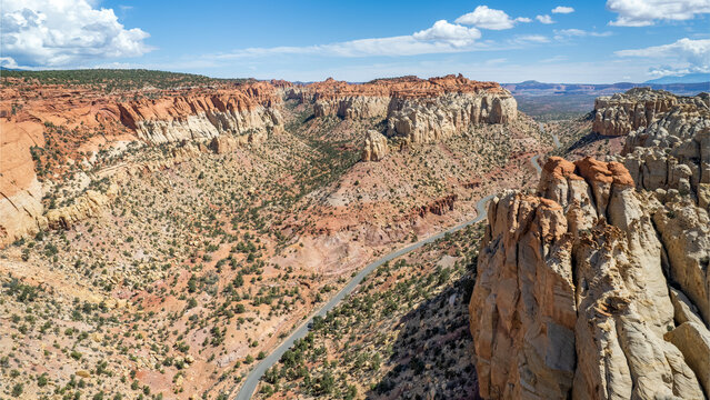 The East Burr Trail Road winding through the red rock walls of Long Canyon, Utah, USA