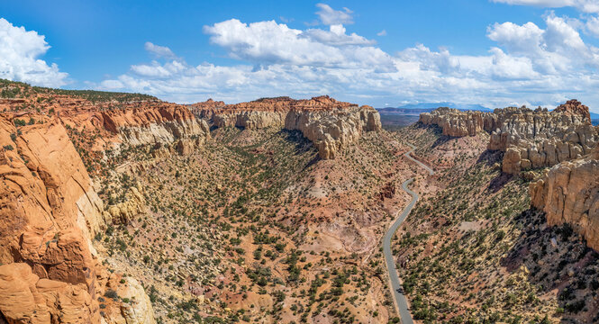 The East Burr Trail Road winding through the red rock walls of Long Canyon, Utah, USA