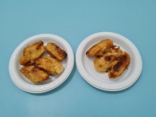 A market snack made from fried bananas wrapped in crispy flour
