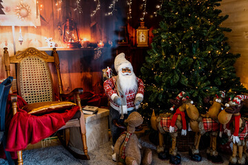 Fototapeta na wymiar christmas santa claus house decoration with reindeer