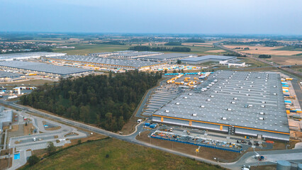 Aerial view of many modern industrial warehouses. Logistics center of the online store
