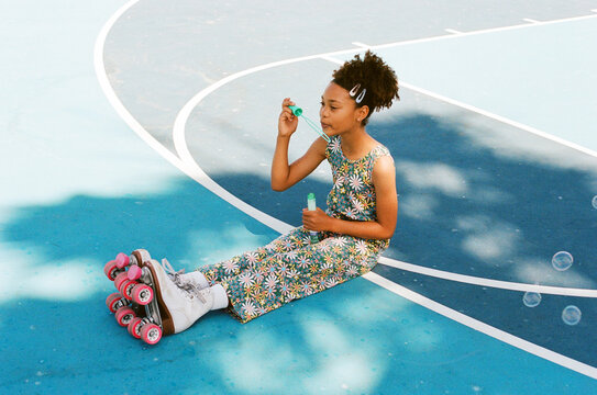 Blowing bubbles in roller-skates