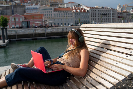 Gen Z freelancer remote working outdoor with laptop