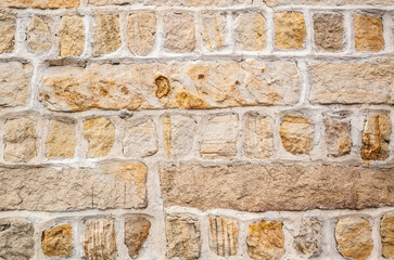 Fototapeta premium aged yellow brick wall