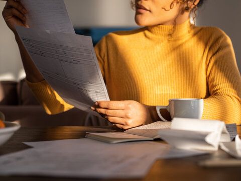 Businesswoman checking papers at home