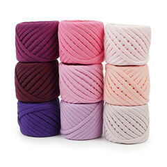 Spools of multi-colored cotton threads on a white background. Cotton yarn in ball and bobbins