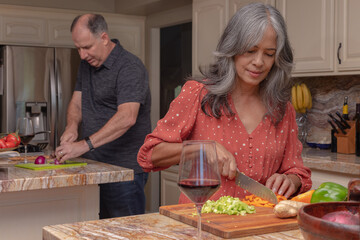 mature couple cooking together 