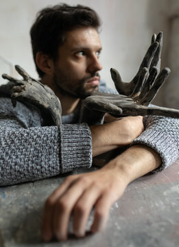 sculptor and five hands