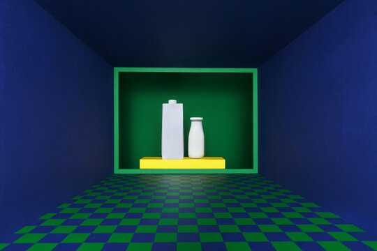 A bottle of rustic milk and cardboard of milk on yellow frame